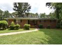 Brick ranch house with landscaping and walkway at 4193 Dunmore Rd, Decatur, GA 30034
