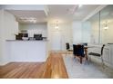 Charming dining area with hardwood floors and a glass-top table for four at 955 Juniper Ne St # 4027, Atlanta, GA 30309