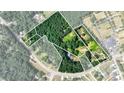 Aerial lot view showing property lines, several houses, and surrounding trees at 3525 Hamilton Mill Rd, Buford, GA 30519