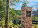 Azalea Square community entrance with brick signage and landscaping at 1206 Brooks Ryan Run(Lot 102), Lawrenceville, GA 30043