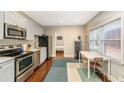 Modern eat-in kitchen, stainless steel appliances, hardwood floor at 604 Glen Iris Ne Dr, Atlanta, GA 30308