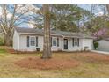Ranch style home with neutral exterior and landscaping at 105 Adrian Dr, Stockbridge, GA 30281