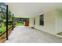 Covered carport with concrete flooring and exterior access at 679 Forest Ridge Se Dr, Marietta, GA 30067