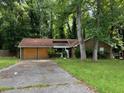 Front yard view of a house needing repairs at 445 Independence Dr, Jonesboro, GA 30238