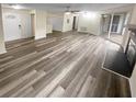 Spacious living room featuring wood-look floors and fireplace at 6383 Wedgewood Trce, Tucker, GA 30084