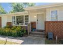 Inviting front entrance with brick facade, landscaping, and a welcoming porch at 2785 Toney Dr, Decatur, GA 30032