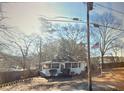 Small house with front porch and American flag at 5180 Westbrook Pl, Union City, GA 30291