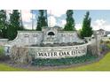 Water Oak Estates community entrance sign at 1718 Lacebark Elm Way, Lawrenceville, GA 30045