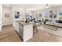 Open floor plan boasting a modern kitchen island and spacious living area at 6375 Rosetta Dr # 86, South Fulton, GA 30331
