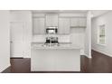 Modern kitchen with gray cabinets and granite countertops at 6375 Rosetta Dr # 86, South Fulton, GA 30331