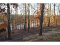 Scenic wooded lot overlooking tranquil lake at 205 Lakeside Pl, Canton, GA 30114