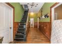 Long entryway with wood floors and staircase at 4115 Hicks Rd, Austell, GA 30106