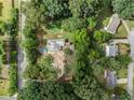 Aerial view showing property, trees, and neighboring houses at 4115 Hicks Rd, Austell, GA 30106