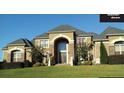 Large two-story house with stone facade and landscaping at 1809 Trinidad, Stockbridge, GA 30281