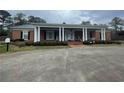 Brick house with a large front porch and columns at 3355 Smithtown Rd, Suwanee, GA 30024