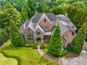 Luxury home situated on a spacious lot with mature trees at 56 Mount Paran Rd, Atlanta, GA 30327