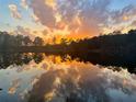 Stunning lakefront sunset reflection at 2646 Lakeshore Ne Dr, Conyers, GA 30012