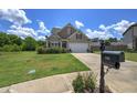 House exterior with driveway and landscaping at 112 Reed Nw Cv, Cartersville, GA 30121