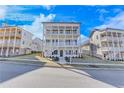 Inviting three-story home with double porches and a classic design at 1264 Six Sisters St, Dacula, GA 30019