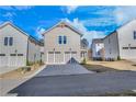 Two-story home with a two-car garage and a landscaped yard at 1274 Six Sisters St, Dacula, GA 30019