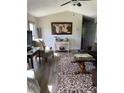 Living room with patterned rug, comfy seating, and art at 160 Scott Rd, Canton, GA 30115