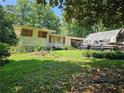 House exterior with yard and carport at 3476 Cooper St, Lithia Springs, GA 30122