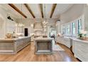 Gourmet kitchen boasts a large island, custom cabinetry, and top-of-the-line appliances at 962 Chattooga Trce, Suwanee, GA 30024
