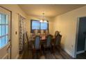 Dining room with hardwood floors and a wood table with six chairs at 286 Pauladean Se Cir, Marietta, GA 30067