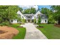 Luxury home with a white brick facade and black accents at 1235 Mount Paran Nw Rd, Atlanta, GA 30327