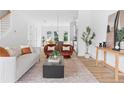 Open living room with light and airy feel, featuring a neutral color palette and stylish furniture at 597 Federal Se Ter, Atlanta, GA 30315