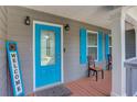 Front porch with a blue door and welcome sign at 126 Holly Ct, Loganville, GA 30052