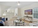 Open living room with hardwood floors and city view at 4254 River Green Nw Dr # 616, Atlanta, GA 30327