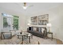 Living room with hardwood floors and balcony access at 4254 River Green Nw Dr # 616, Atlanta, GA 30327