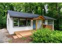 Charming white brick ranch home with a new deck and landscaping at 1941 Wells Sw Dr, Atlanta, GA 30311