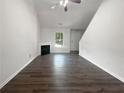 Living room with fireplace and dark hardwood floors at 313 Lauren Dr, Fairburn, GA 30213