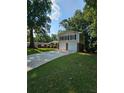 Two-story house with attached garage and a well-manicured lawn at 4670 Eberline Ct, Stone Mountain, GA 30083