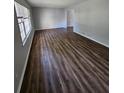 Spacious living room with hardwood floors and large windows at 4670 Eberline Ct, Stone Mountain, GA 30083