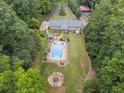 Home with pool, spacious backyard and detached garage at 3992 Doc Sams Rd, Cumming, GA 30028