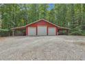 Triple-car garage with covered parking and gravel area at 3992 Doc Sams Rd, Cumming, GA 30028