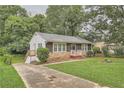 Ranch style home with driveway and a nice front yard at 2666 Blount St, Atlanta, GA 30344