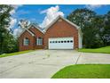 Brick home with attached garage and long driveway at 37 Red Fox Trl, Euharlee, GA 30145