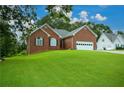 Brick ranch home with attached garage and large yard at 37 Red Fox Trl, Euharlee, GA 30145