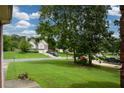 Landscaped yard with view of neighboring homes at 37 Red Fox Trl, Euharlee, GA 30145