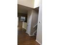 Hardwood floor hallway with staircase and storage closet at 585 Mcwilliams Se Rd # 2307, Atlanta, GA 30315