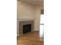 Living room with corner fireplace and hardwood floors at 585 Mcwilliams Se Rd # 2307, Atlanta, GA 30315