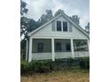 White house with front porch and landscaping at 2203 Hillcrest Ave, Decatur, GA 30032
