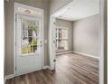 Bright entryway with hardwood floors and view into an adjacent room at 320 Pintail Ct, Suwanee, GA 30024