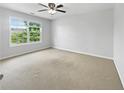 Spacious bedroom with large window and ceiling fan at 2669 Saint Paul Sw Dr, Atlanta, GA 30331