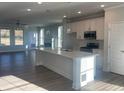 Modern kitchen featuring a large island and stainless steel appliances at 2414 Anhinga Dr, Loganville, GA 30052