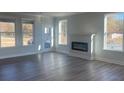 Spacious living room with fireplace and hardwood floors at 2414 Anhinga Dr, Loganville, GA 30052